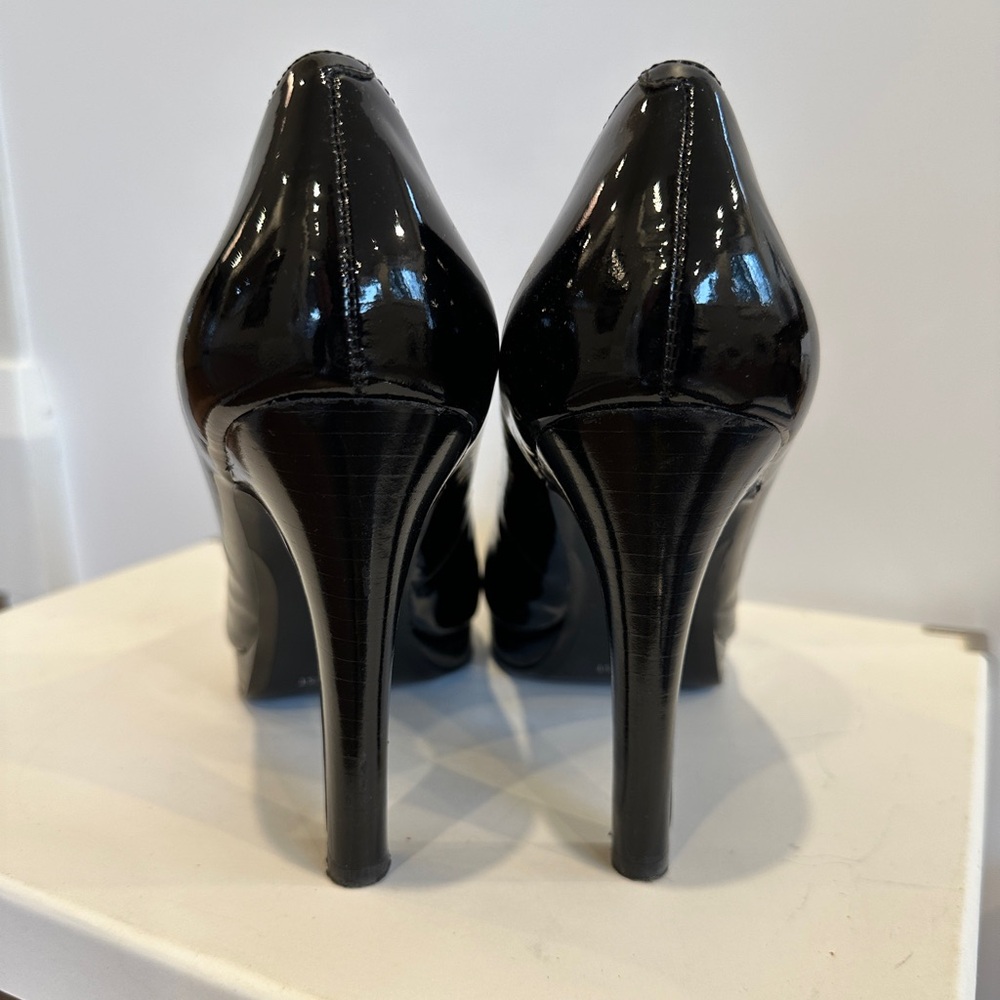 Classic patent peep toe. Worn twice.  Looks killer with shiny black pedi.